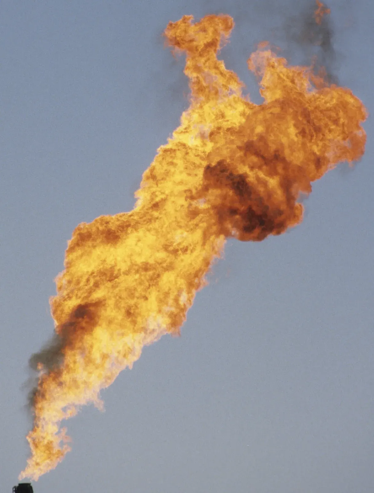 Flare burning gas during a flow test on an onshore oil well
